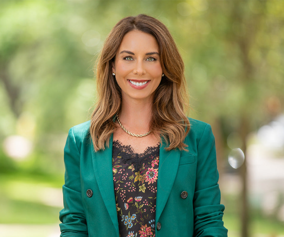 dr. emily jamea in a green blazer